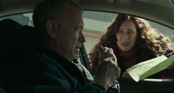 Movie still from “A Man Called Otto” (2022), directed by Marc Forster – A man and a woman in the back seat of a car; Close Up shot, Over the shoulder angle
