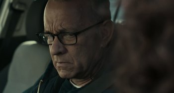Movie still from “A Man Called Otto” (2022), directed by Marc Forster – An older man wearing glasses and a black shirt; Close Up shot, Over the shoulder angle