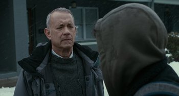 Movie still from “A Man Called Otto” (2022), directed by Marc Forster – An older man in a gray jacket is looking at another older man; Close Up shot, Over the shoulder angle