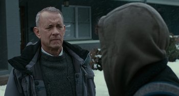 Movie still from “A Man Called Otto” (2022), directed by Marc Forster – An older man in a gray jacket is looking at a younger man; Close Up shot, Over the shoulder angle