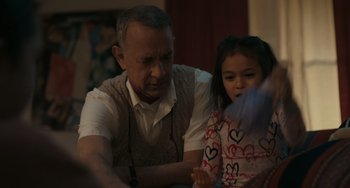 Movie still from “A Man Called Otto” (2022), directed by Marc Forster – An older man and a young girl sitting at a table; Close Up shot, Over the shoulder angle