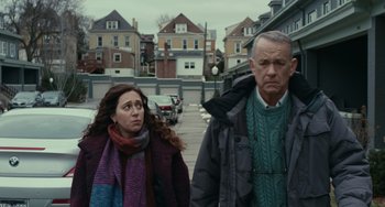 Movie still from “A Man Called Otto” (2022), directed by Marc Forster – A woman and a man walking down a street; Medium shot, Low angle