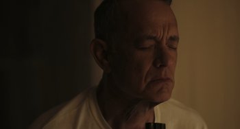 Movie still from “A Man Called Otto” (2022), directed by Marc Forster – An older man with his eyes closed and his head down; Close Up shot, Low angle