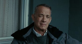 Movie still from “A Man Called Otto” (2022), directed by Marc Forster – An older man wearing a sweater and a jacket; Close Up shot, Low angle