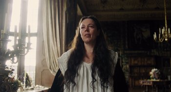Movie still from “The Favourite” (2018), directed by Yorgos Lanthimos – A woman with long black hair standing in a room; Close Up shot, Low angle