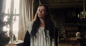 Movie still from “The Favourite” (2018), directed by Yorgos Lanthimos – A woman with long black hair standing in a room; Medium shot, Low angle