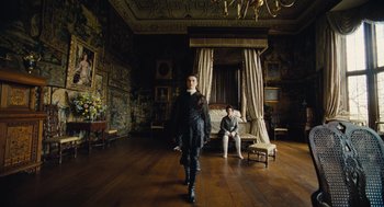 Movie still from “The Favourite” (2018), directed by Yorgos Lanthimos – A man and a woman are in a room with a bed; Wide shot, Low angle