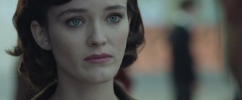 A woman's face with green eyes