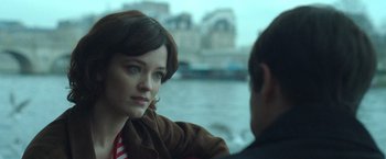 A woman sitting next to a man on a boat