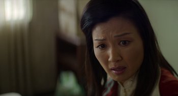 Movie still from “A Million Miles Away” (2023), directed by Alejandra Márquez Abella – A person with long black hair; Close Up shot, Over the shoulder angle