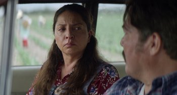 Movie still from “A Million Miles Away” (2023), directed by Alejandra Márquez Abella – A woman in a red shirt and a man in a plaid shirt; Close Up shot, Over the shoulder angle