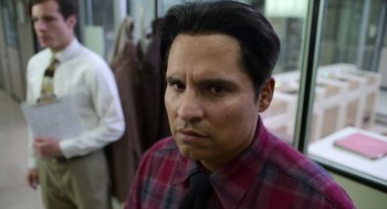 Movie still from “A Million Miles Away” (2023), directed by Alejandra Márquez Abella – A person wearing a shirt and a tie; Close Up shot, Over the shoulder angle