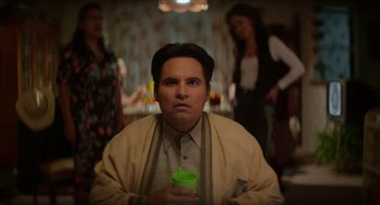 Movie still from “A Million Miles Away” (2023), directed by Alejandra Márquez Abella – A man with a green cup in his hand; Medium shot, Over the shoulder angle