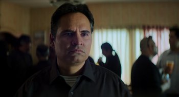 Movie still from “A Million Miles Away” (2023), directed by Alejandra Márquez Abella – A person wearing a black shirt; Close Up shot, Over the shoulder angle
