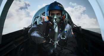 Movie still from “A Million Miles Away” (2023), directed by Alejandra Márquez Abella – A man in a fighter pilot's gear in the cockpit of an aircraft; Medium shot, Low angle