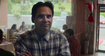 Movie still from “A Million Miles Away” (2023), directed by Alejandra Márquez Abella – A person wearing a plaid shirt; Close Up shot, Over the shoulder angle