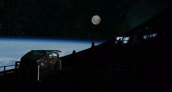 Movie still from “A Million Miles Away” (2023), directed by Alejandra Márquez Abella – A view of the earth from a space station window; Extreme Wide shot, Overhead angle