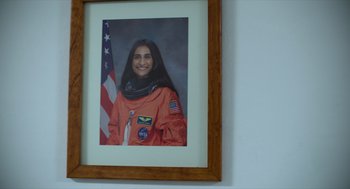 Movie still from “A Million Miles Away” (2023), directed by Alejandra Márquez Abella – A picture of a woman in an astronaut suit; Close Up shot, Low angle