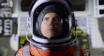 Movie still from “A Million Miles Away” (2023), directed by Alejandra Márquez Abella – A person wearing a space suit; Close Up shot, Low angle
