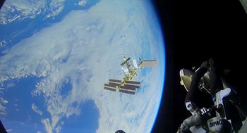 Movie still from “A Million Miles Away” (2023), directed by Alejandra Márquez Abella – The international space station is seen from a space shuttle; Extreme Wide shot, Overhead angle