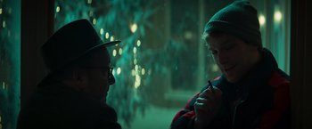 Movie still from “A Night at the Kindergarten” (2022), directed by Rafal Skalski – A man and a woman are talking in the dark; Close Up shot, Over the shoulder angle