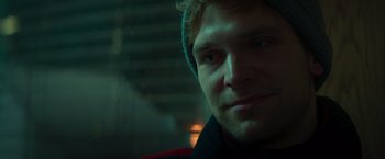 Movie still from “A Night at the Kindergarten” (2022), directed by Rafal Skalski – A person wearing a hat; Close Up shot, Low angle