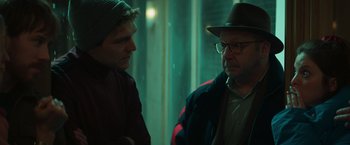 Movie still from “A Night at the Kindergarten” (2022), directed by Rafal Skalski – Two men are standing in a room talking to each other; Close Up shot, Over the shoulder angle