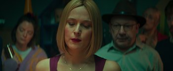 Movie still from “A Night at the Kindergarten” (2022), directed by Rafal Skalski – A person wearing a hat; Close Up shot, Over the shoulder angle