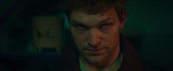 Movie still from “A Night at the Kindergarten” (2022), directed by Rafal Skalski – A person with a beard; Close Up shot, Low angle