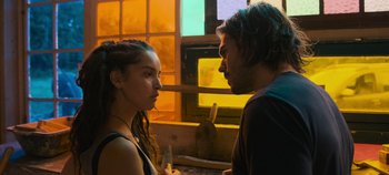 Movie still from “A Place to Fight For” (2023), directed by Romain Cogitore – A man and a woman standing next to each other in front of a window; Close Up shot, Over the shoulder angle