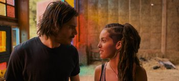 Movie still from “A Place to Fight For” (2023), directed by Romain Cogitore – A man and a woman standing next to each other; Close Up shot, Over the shoulder angle