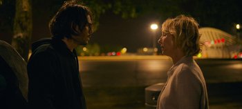Movie still from “A Place to Fight For” (2023), directed by Romain Cogitore – A man and a woman talking to each other; Medium shot, Over the shoulder angle