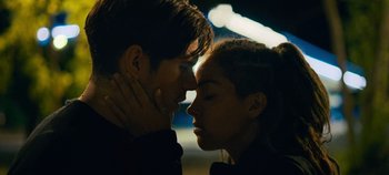 Movie still from “A Place to Fight For” (2023), directed by Romain Cogitore – A man and a woman kissing in the dark; Close Up shot, Over the shoulder angle
