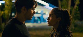 Movie still from “A Place to Fight For” (2023), directed by Romain Cogitore – A man and a woman face to face in the dark; Close Up shot, Over the shoulder angle