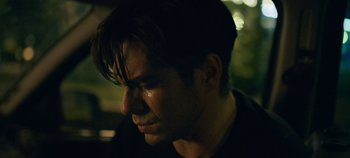 Movie still from “A Place to Fight For” (2023), directed by Romain Cogitore – A person looking down at his face; Close Up shot, Over the shoulder angle
