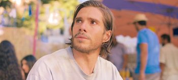 Movie still from “A Place to Fight For” (2023), directed by Romain Cogitore – A person with long hair; Close Up shot, Over the shoulder angle