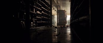 Movie still from “A Quiet Place” (2018), directed by John Krasinski – A warehouse filled with lots of stacks of boxes; Extreme Wide shot, Low angle