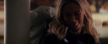 Movie still from “A Quiet Place” (2018), directed by John Krasinski – A woman sitting on top of a bed with a backpack; Close Up shot, Over the shoulder angle