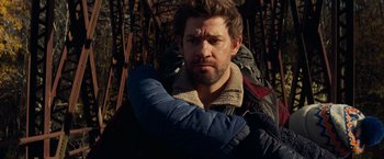 Movie still from “A Quiet Place” (2018), directed by John Krasinski – A person wearing a jacket; Medium shot, Low angle