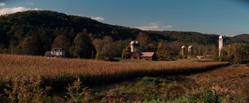 Movie still from “A Quiet Place” (2018), directed by John Krasinski – An old barn sits in the middle of a field; Extreme Wide shot, High angle
