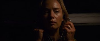 Movie still from “A Quiet Place” (2018), directed by John Krasinski – A woman holding a cell phone in her hand; Close Up shot, Low angle