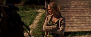 Movie still from “A Quiet Place” (2018), directed by John Krasinski – A beautiful blonde woman in a yellow dress; Medium shot, Over the shoulder angle