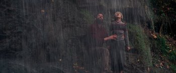 Movie still from “A Quiet Place” (2018), directed by John Krasinski – A man and a woman standing in the rain; Wide shot, Low angle
