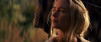 Movie still from “A Quiet Place” (2018), directed by John Krasinski – A person with a person holding an umbrella; Close Up shot, Low angle