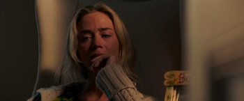 Movie still from “A Quiet Place” (2018), directed by John Krasinski – A woman with her hand on her mouth; Close Up shot, Over the shoulder angle
