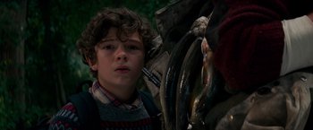 Movie still from “A Quiet Place” (2018), directed by John Krasinski – A young boy is looking at the camera; Close Up shot, Low angle