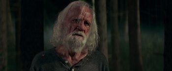 Movie still from “A Quiet Place” (2018), directed by John Krasinski – An old man with a long white beard; Close Up shot, Low angle