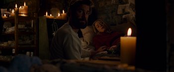 Movie still from “A Quiet Place” (2018), directed by John Krasinski – A man and a woman laying on a bed; Medium shot, Low angle