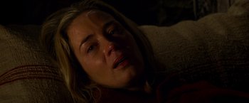 Movie still from “A Quiet Place” (2018), directed by John Krasinski – A person laying on a couch; Close Up shot, High angle
