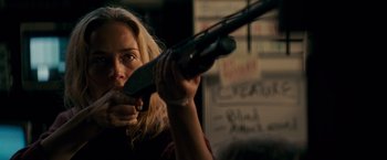 Movie still from “A Quiet Place” (2018), directed by John Krasinski – A woman is holding a rifle in her hands; Close Up shot, Over the shoulder angle